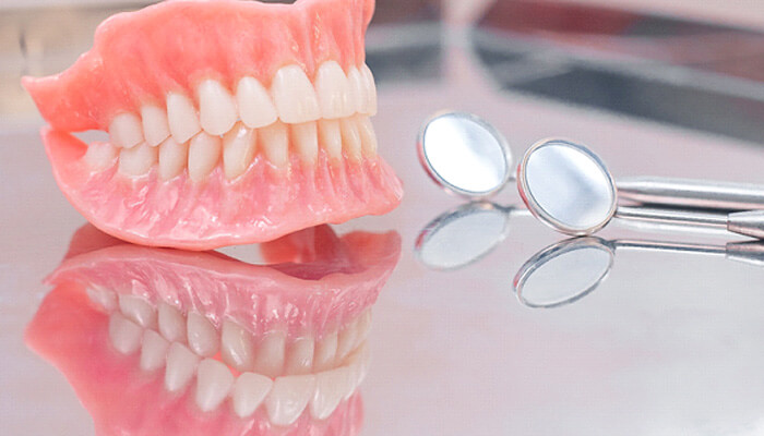 close-up of dentures in st. peters. mo on a reflective table