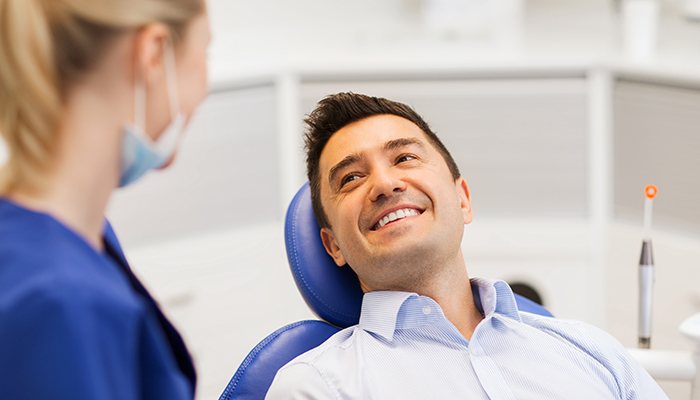 Man smiling at dentist during visit